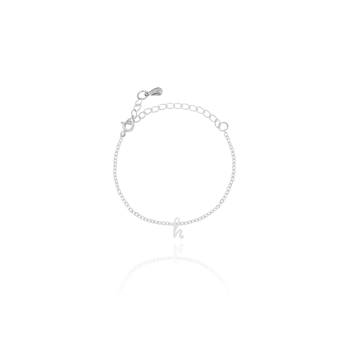 Silver-tone bracelet with small cursive h charm and adjustable chain on white background