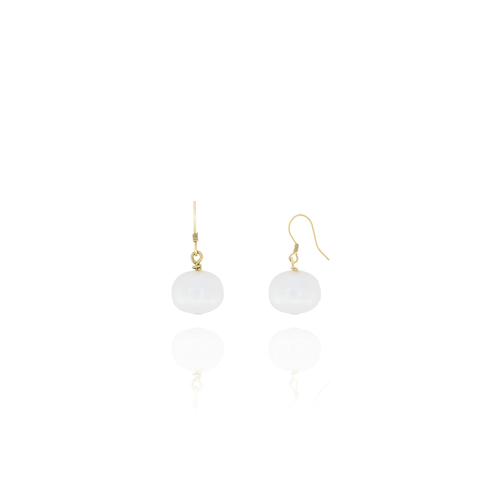 A pair of dangle earrings featuring genuine freshwater pearls attached to ear hooks via gold-colored vermeil wiring.