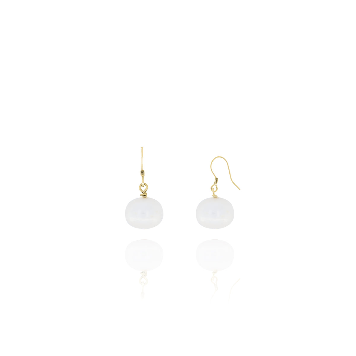 Pair of gold-tone dangle earrings with white round drops on a white background