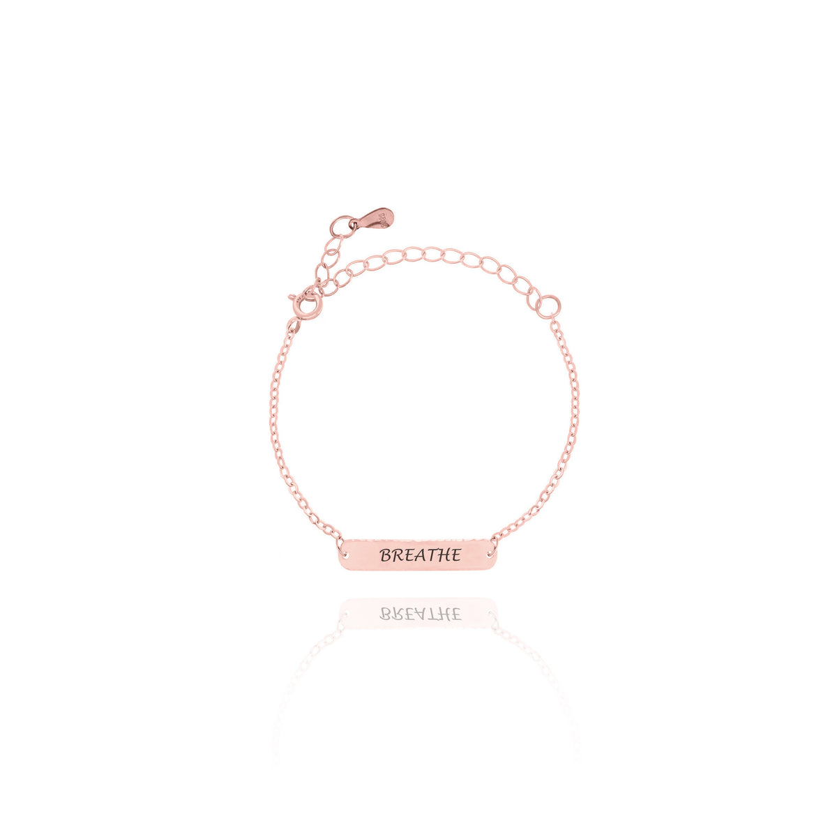 Rose-gold-tone bar bracelet engraved BREATHE on white background