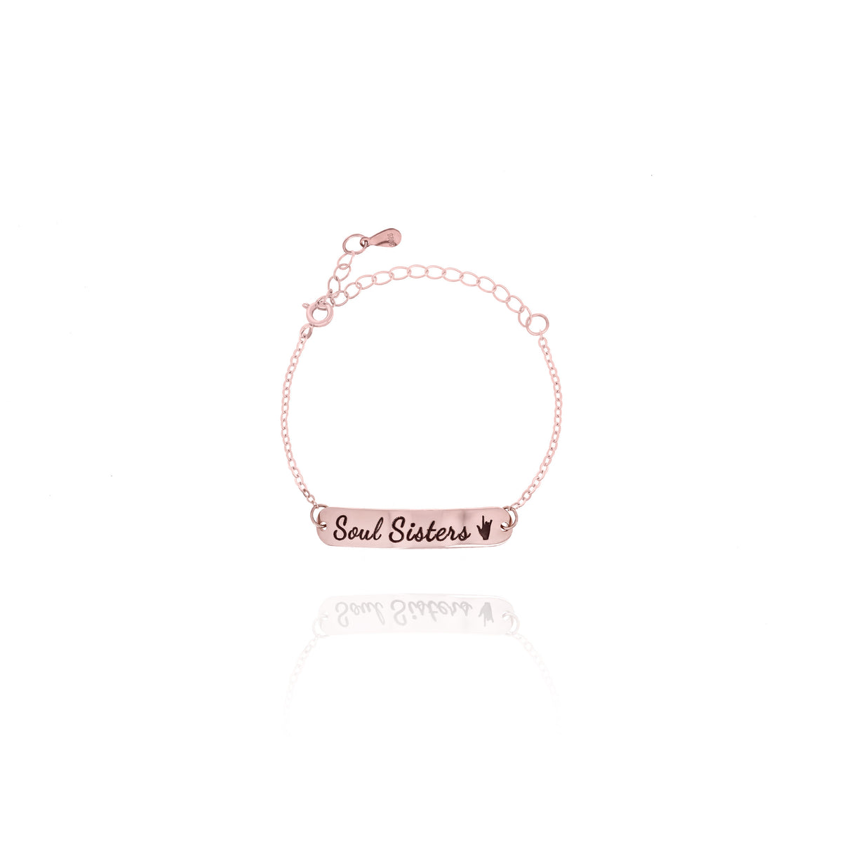 Rose-gold-tone bar bracelet engraved Soul Sisters with a heart on a white background