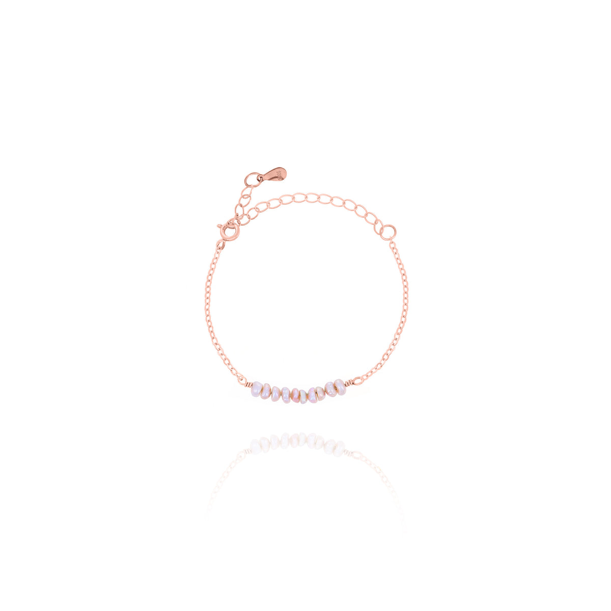 Rose-gold-tone chain bracelet with a row of pale lavender oval beads on a white background