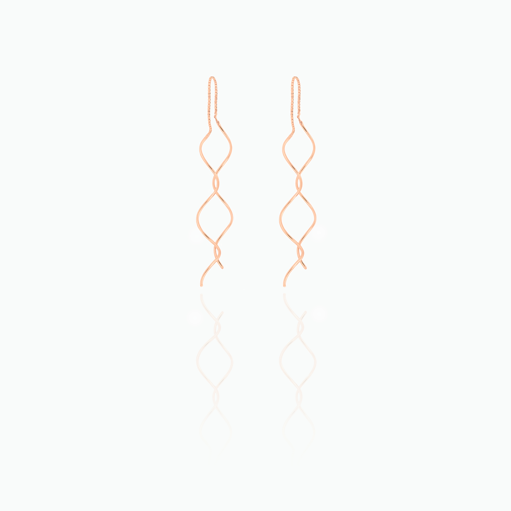 Pair of rose gold earrings on a white background