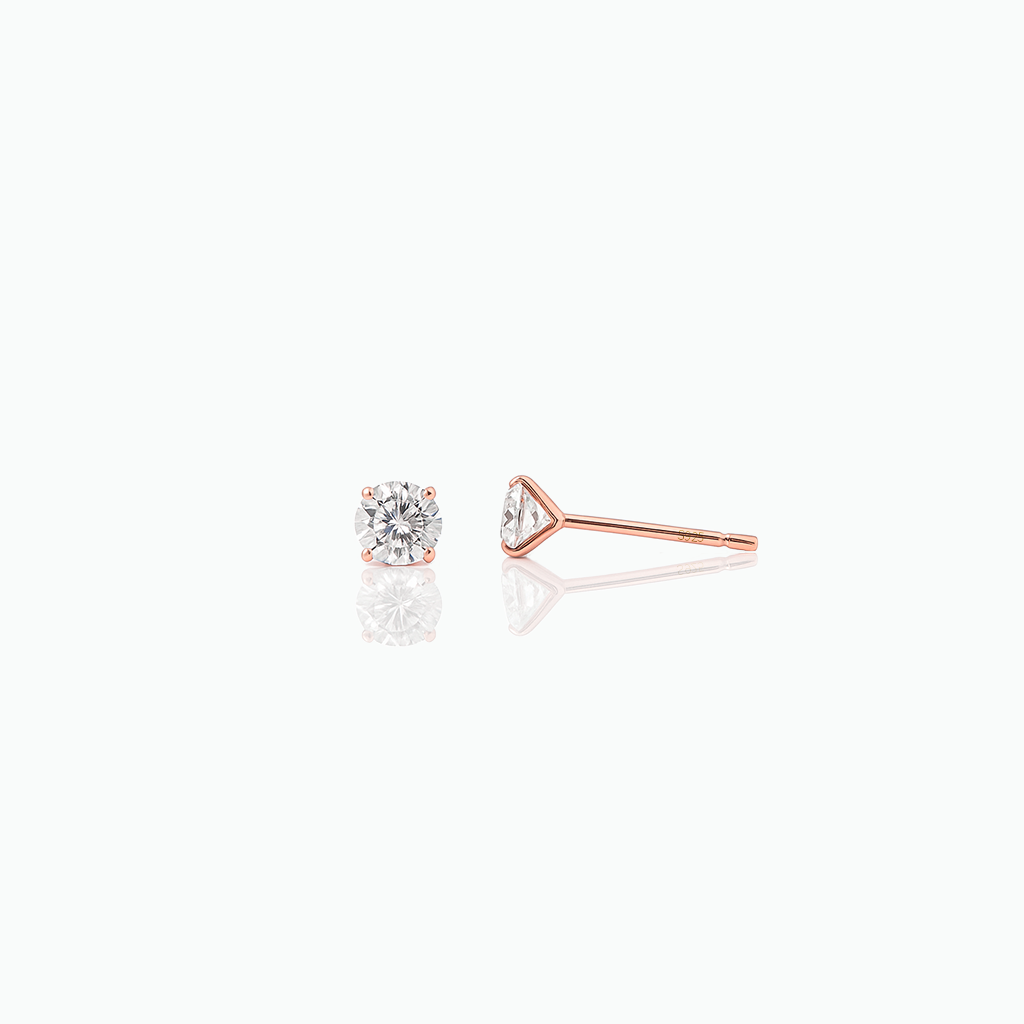 Rose gold diamond stud earrings on a white background