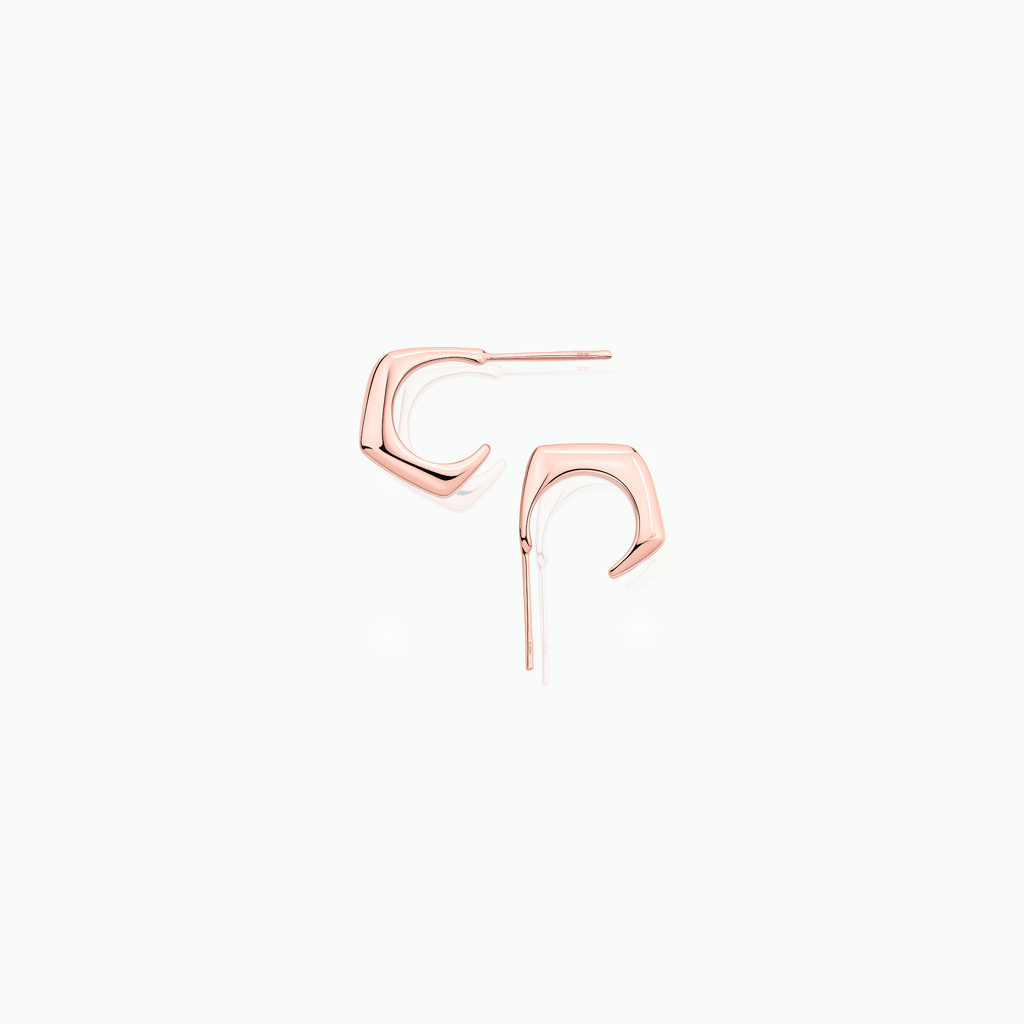 Rose gold stud earrings on a white background