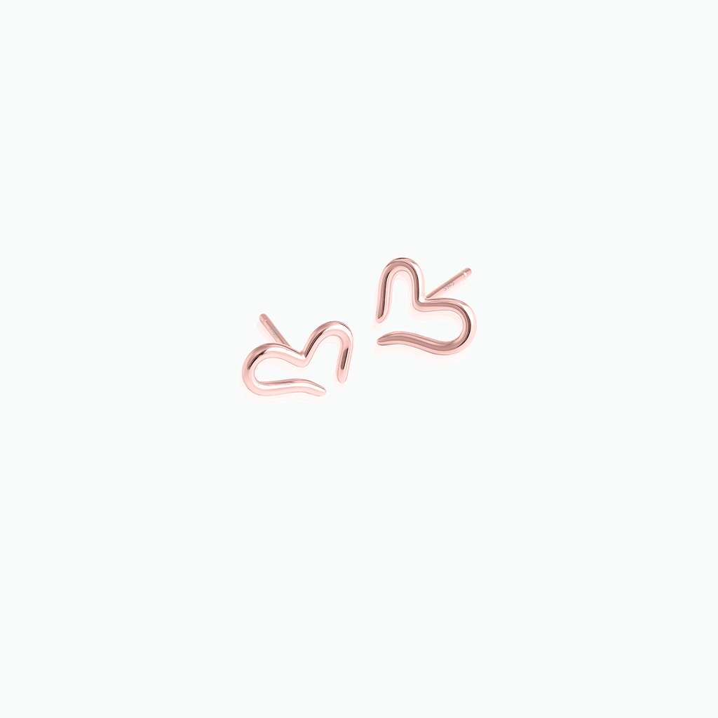 Rose gold heart-shaped earrings on a white background