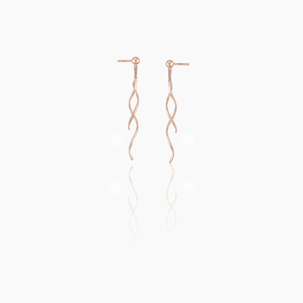 Rose Gold earrings with a wavy design on a white background