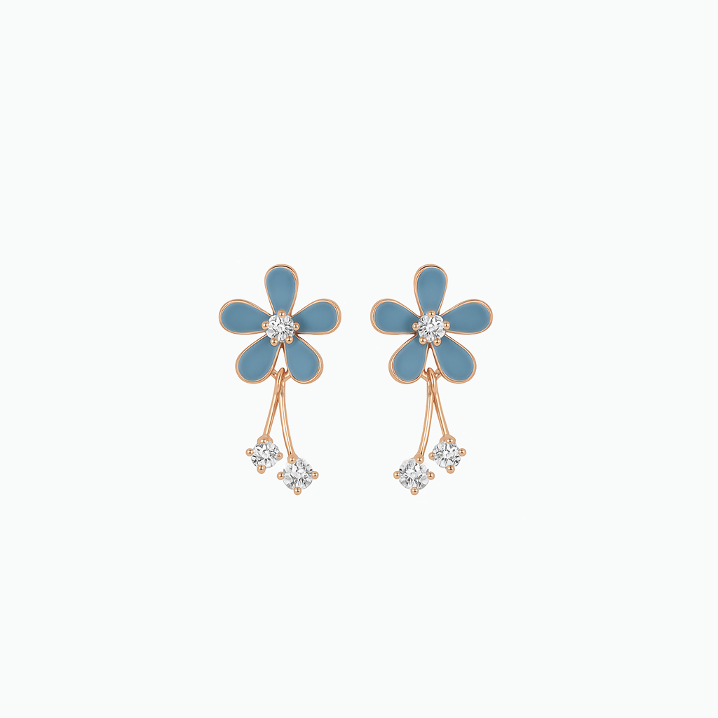 Blue flower-shaped earrings with rose gold accents on a white background