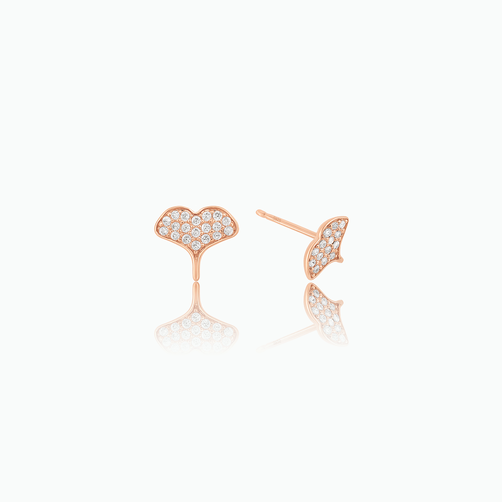 Rose gold-tone crystal-set whale tail stud earrings shown from front and side on a white background