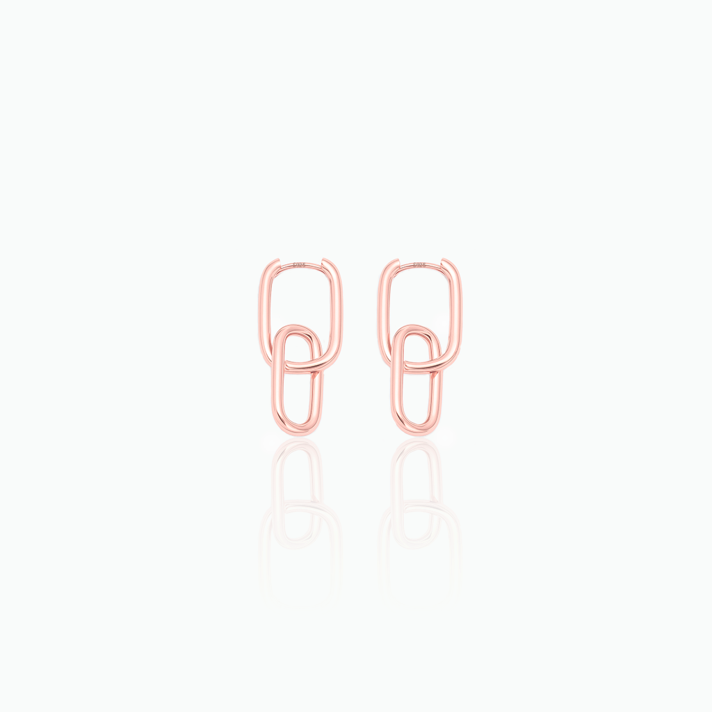 Pair of rose gold chain-link earrings on a white background