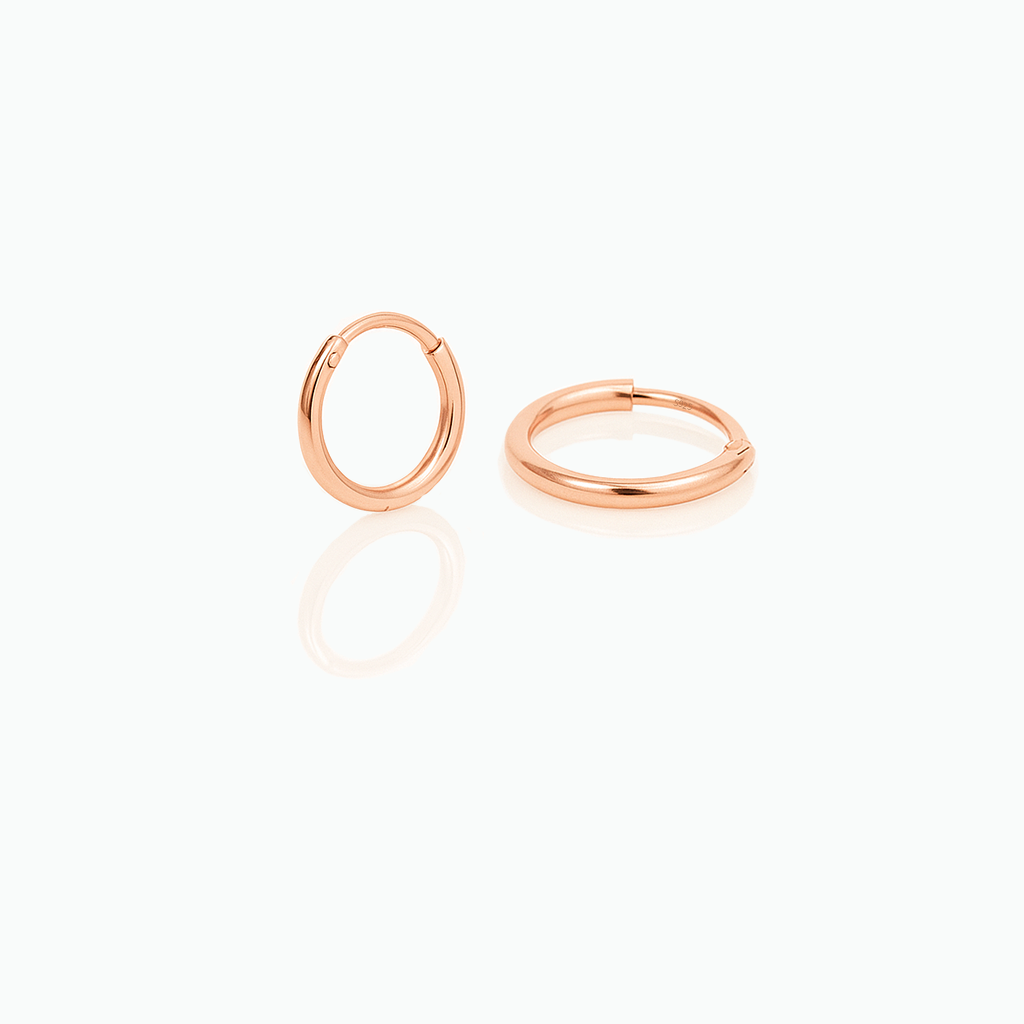 Rose gold hoop earrings on a white background