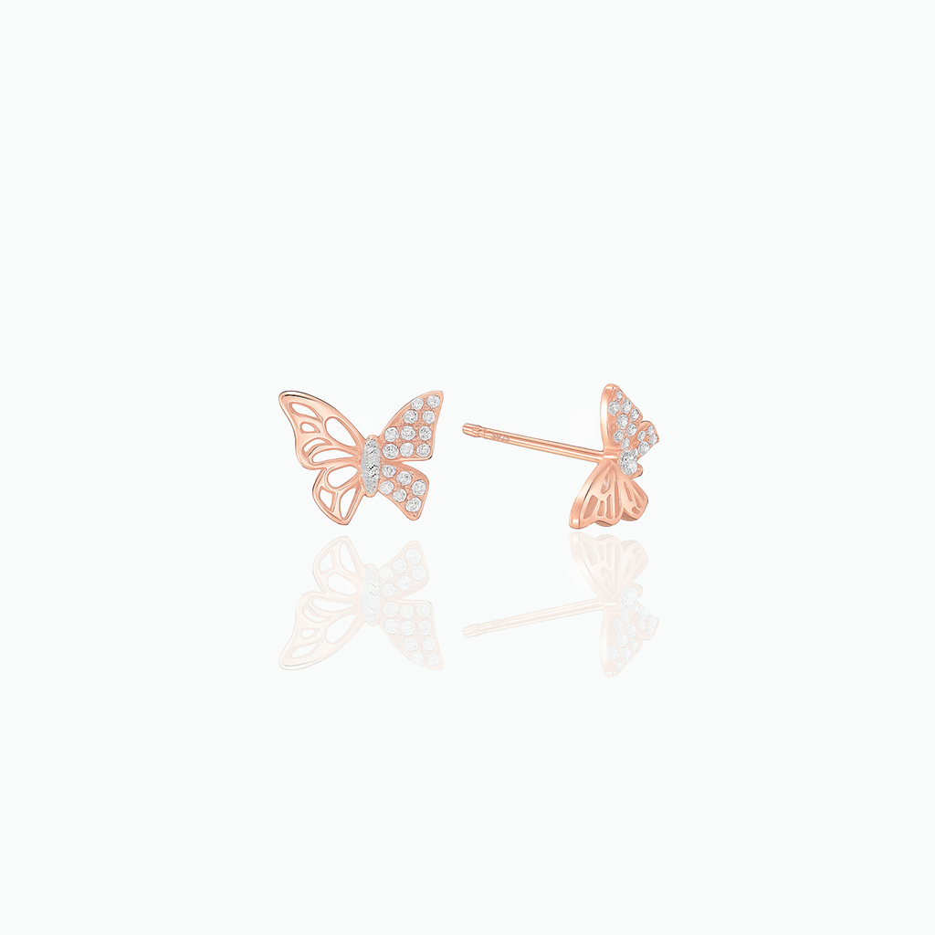 Rose gold butterfly earrings with clear gemstones on a white background