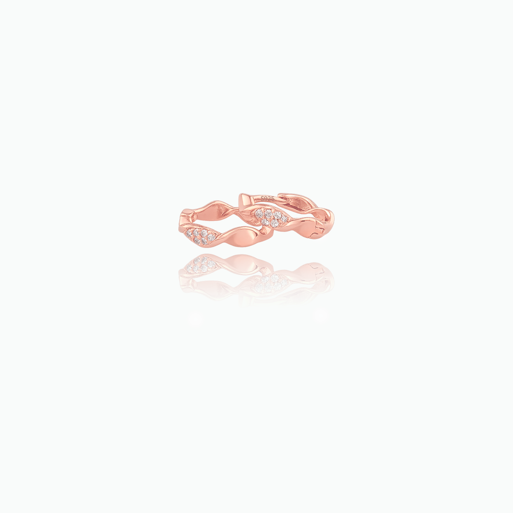 Rose gold ring with diamond on a white background