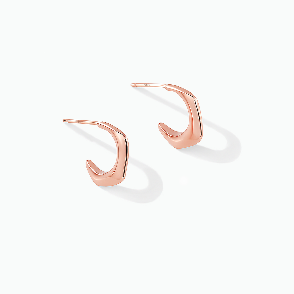 Rose gold-tone angular hook earrings displayed on a white background
