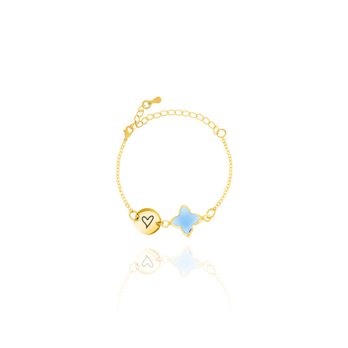 Gold-tone bracelet with engraved round disc and pale blue four-lobed stone on white background