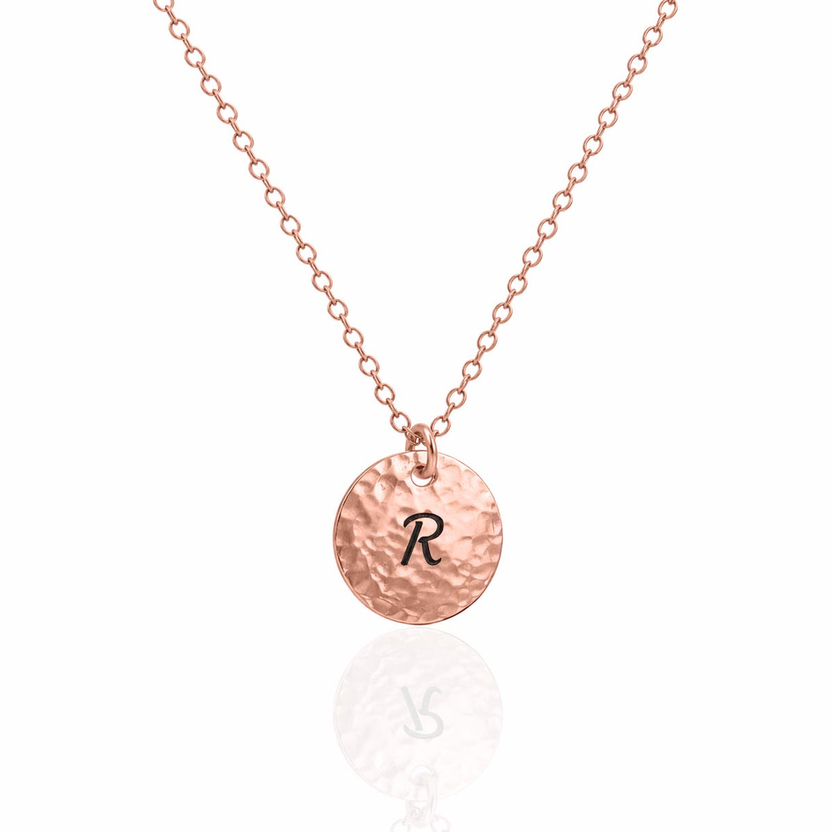 Rose-gold-tone hammered disc necklace engraved with R on a white background