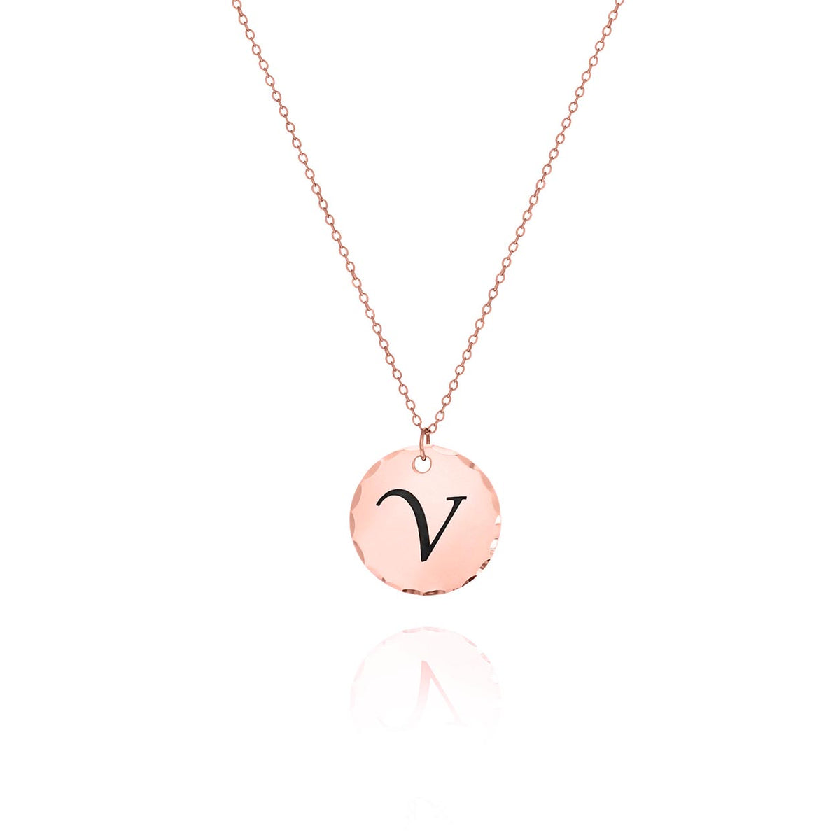 Rose-gold-tone round disc necklace with hammered edge and engraved letter V on a white background