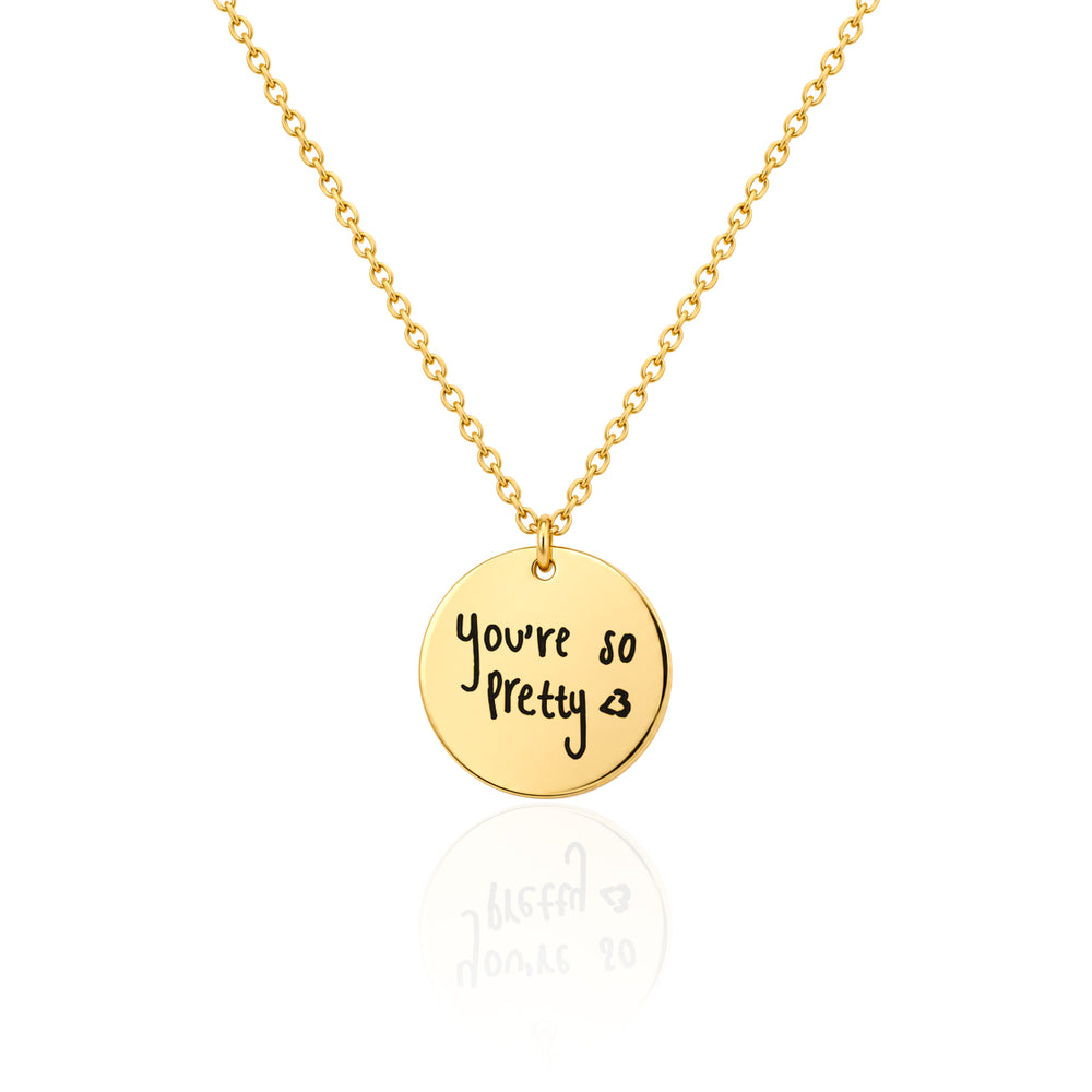 Gold finish round disc necklace engraved with a handwritten message on a fine cable chain