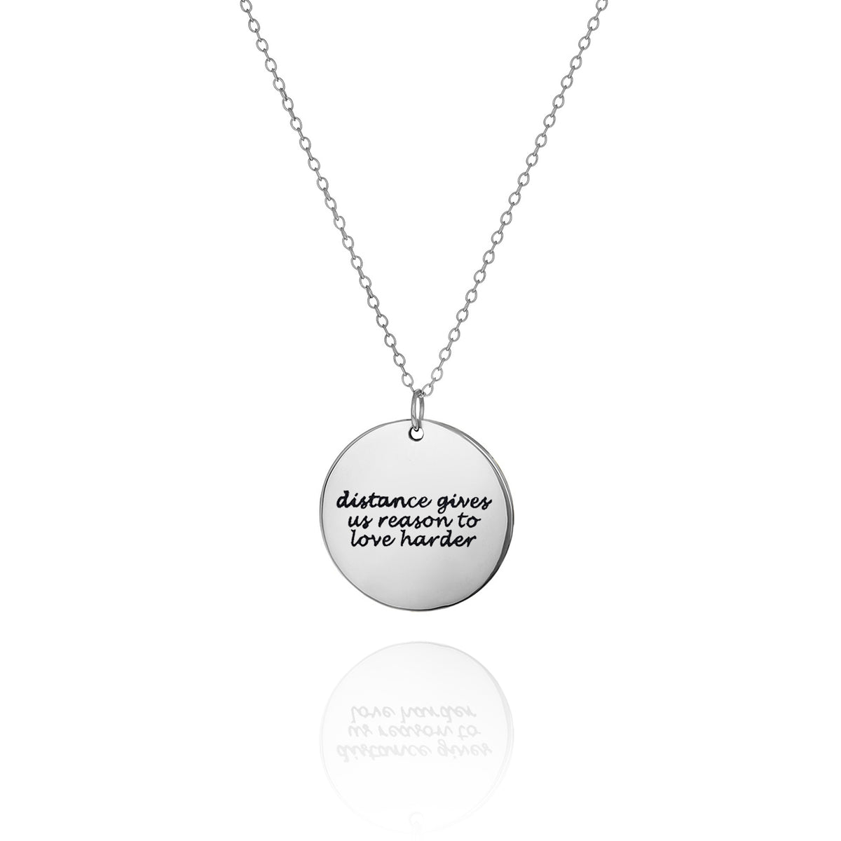 Silver-tone round message disc necklace engraved with distance gives us reason to love harder