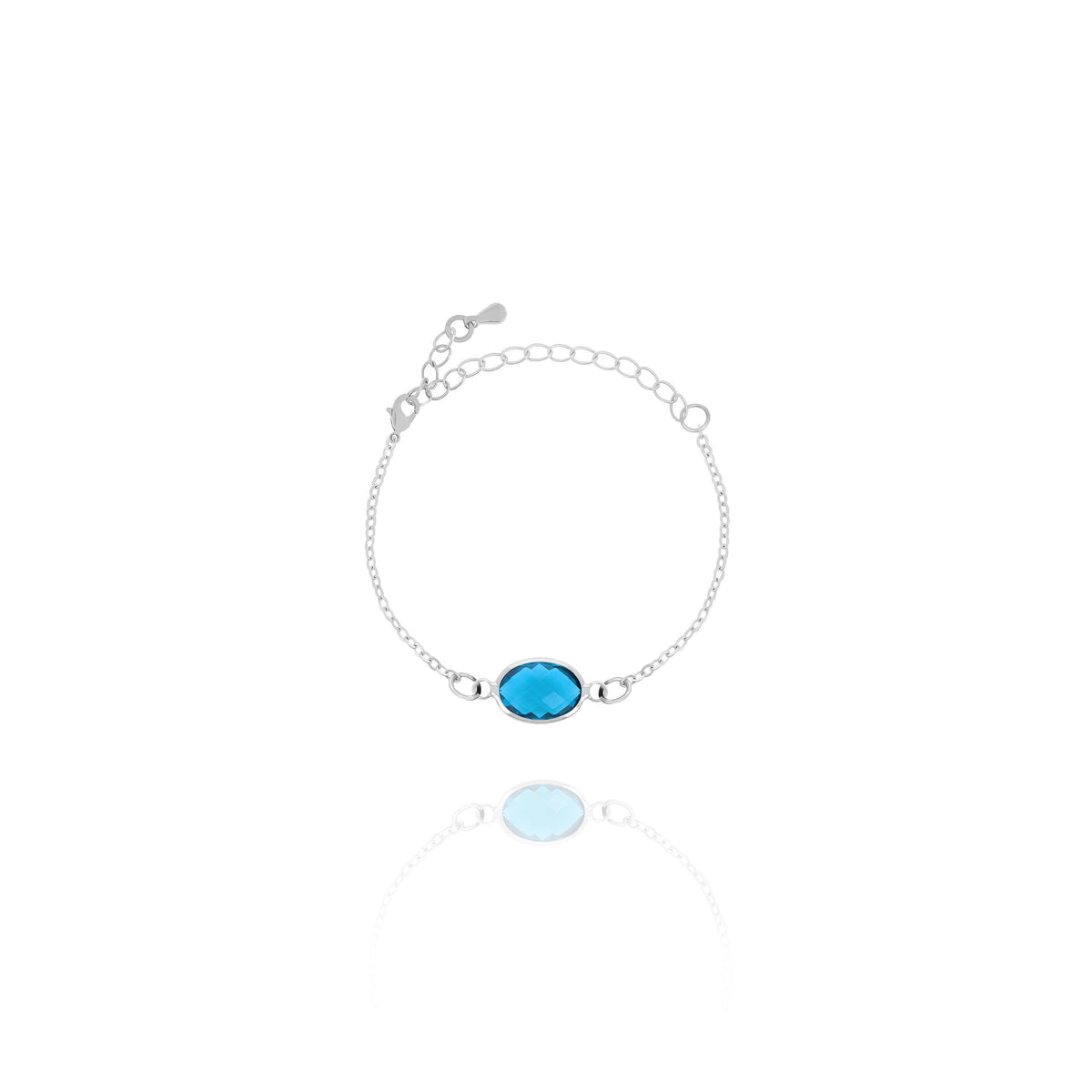 Silver-tone bracelet with bright blue faceted oval stone and adjustable chain on white background