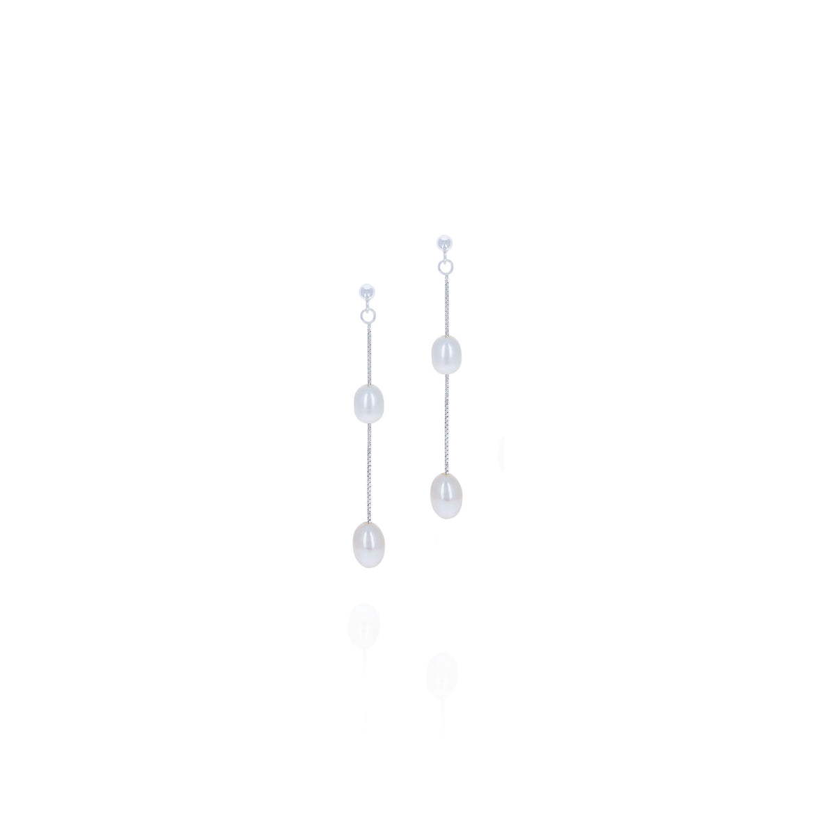 Pair of silver-tone drop earrings with two white pearl beads on fine chains against a white background