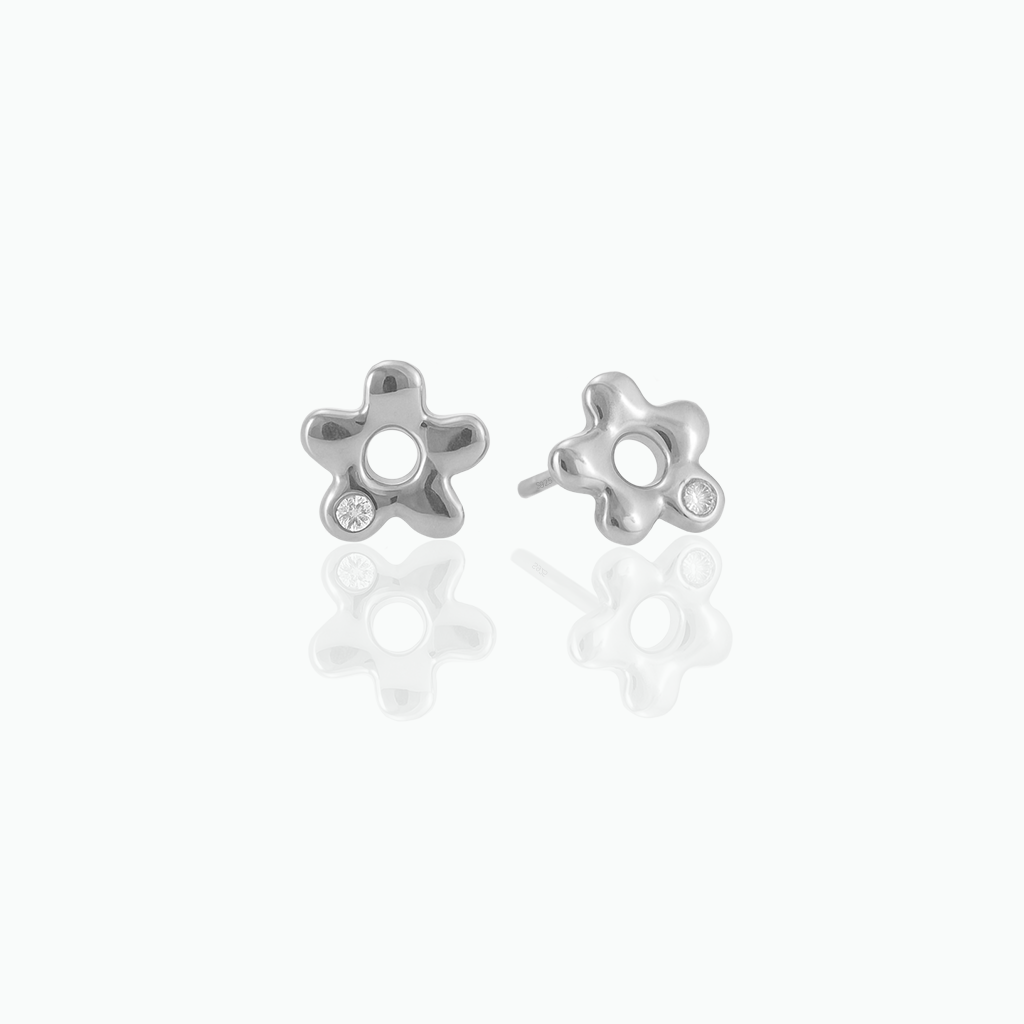 Silver-tone flower stud earrings with clear stone accents displayed on a white background