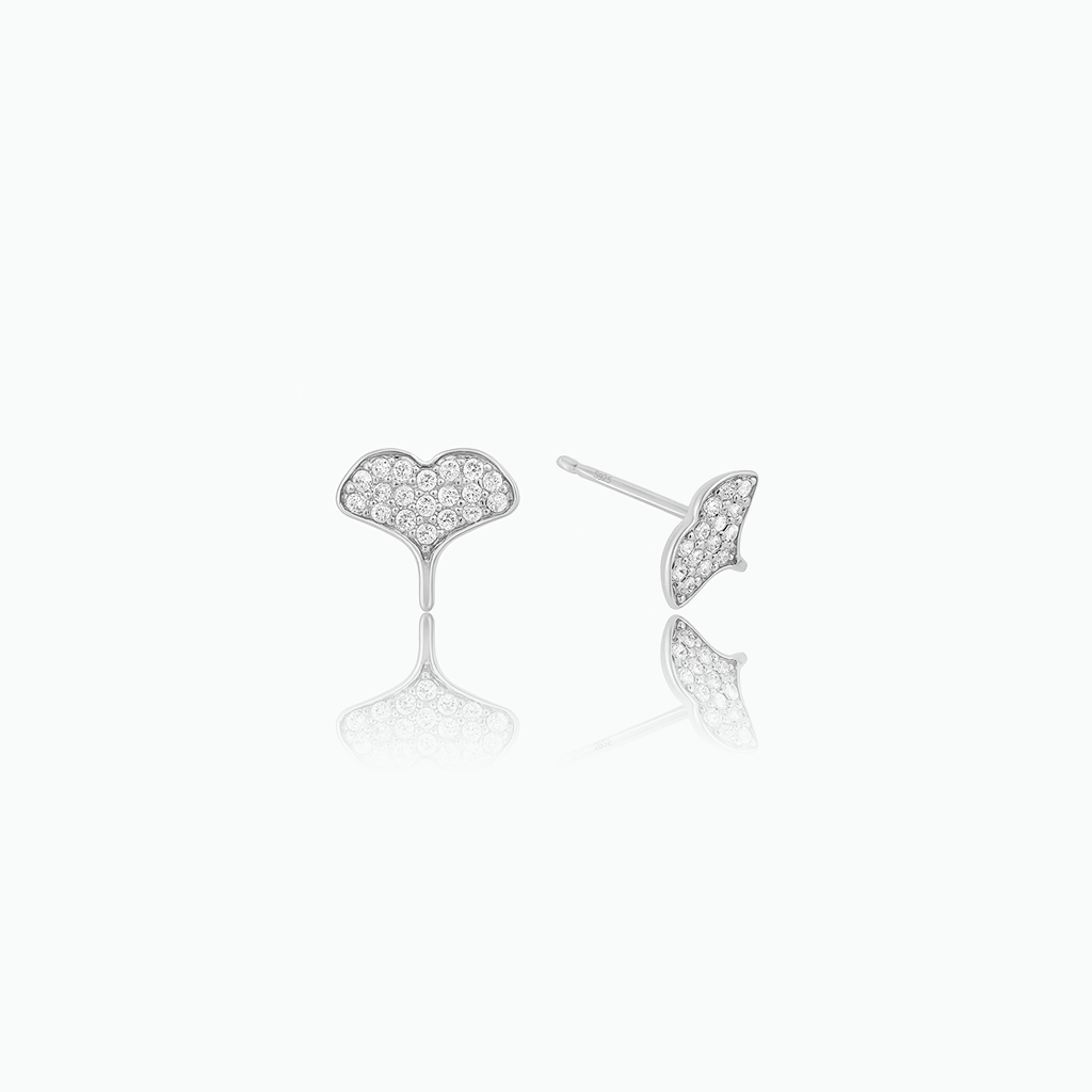 Silver-tone crystal-set whale tail stud earrings shown from front and side on a white background