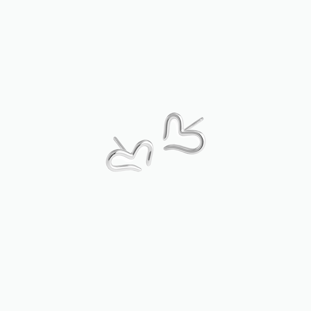 Pair of silver heart-shaped earrings on a white background