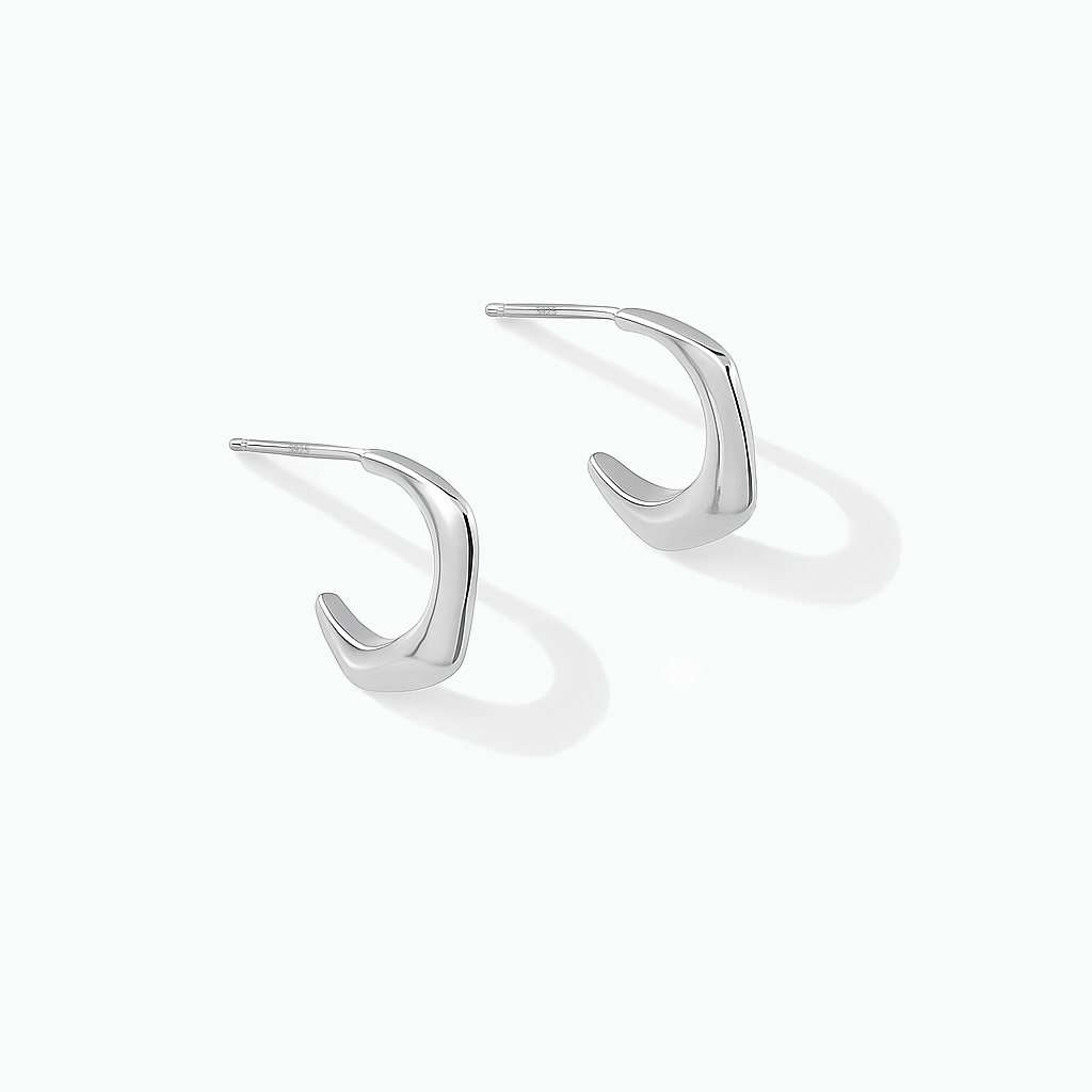 Silver-tone angular hook earrings displayed on a white background