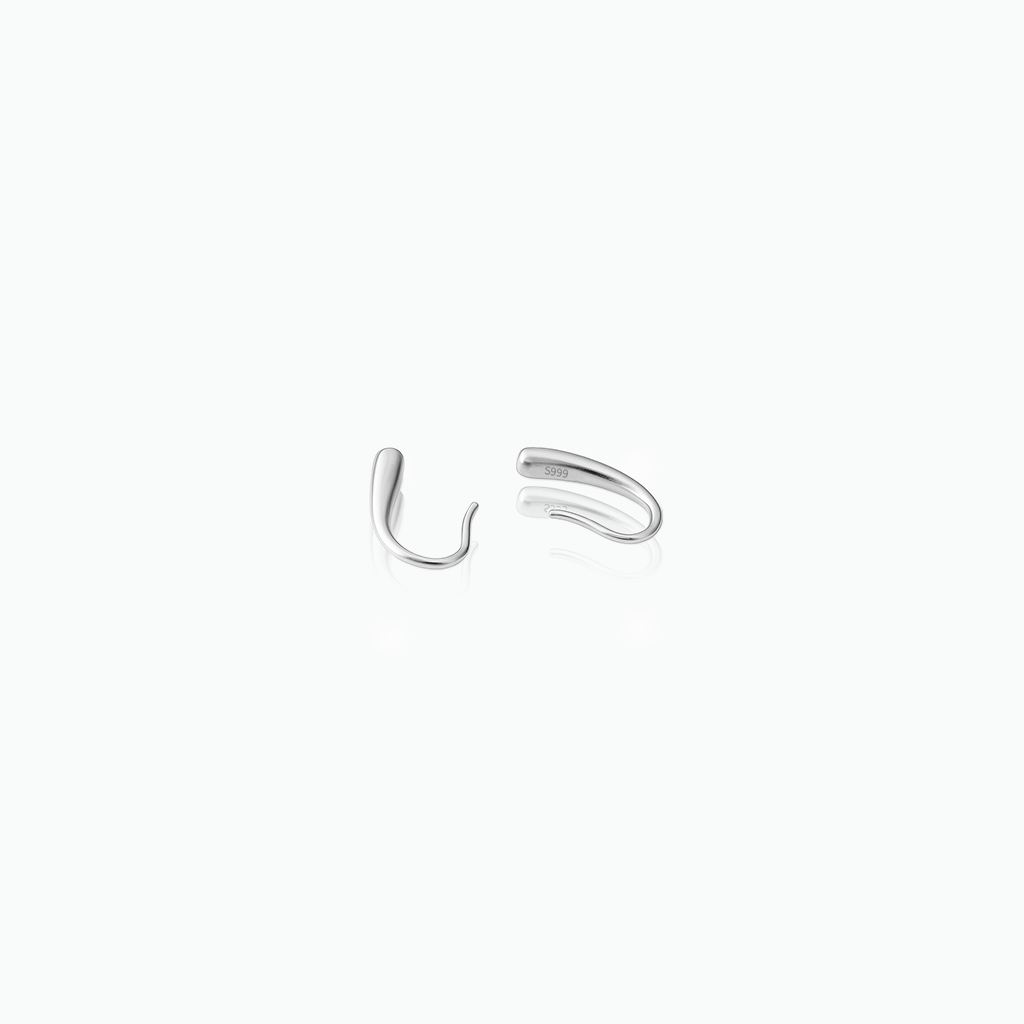 Pair of silver hoop earrings on a white background