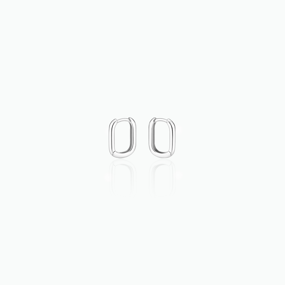 Silver hoop earrings in a white background
