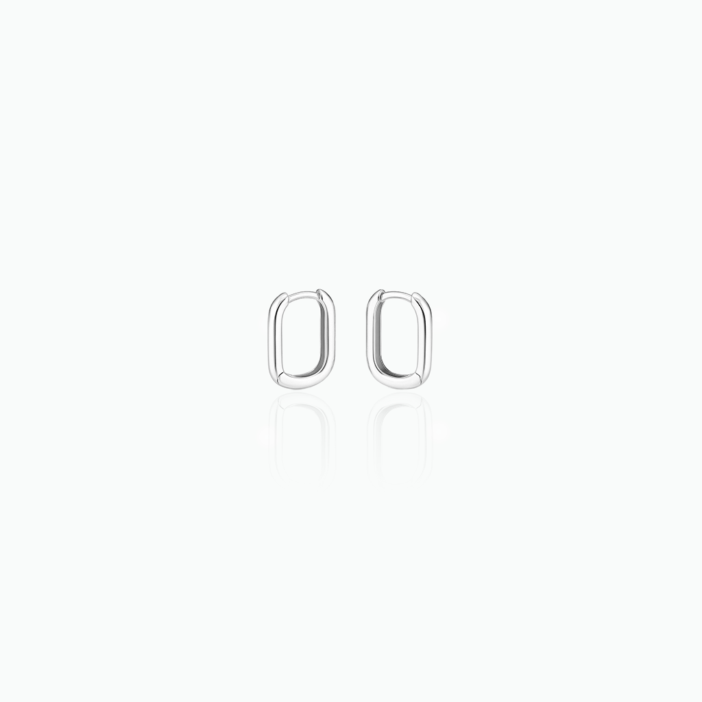 Silver hoop earrings in a white background