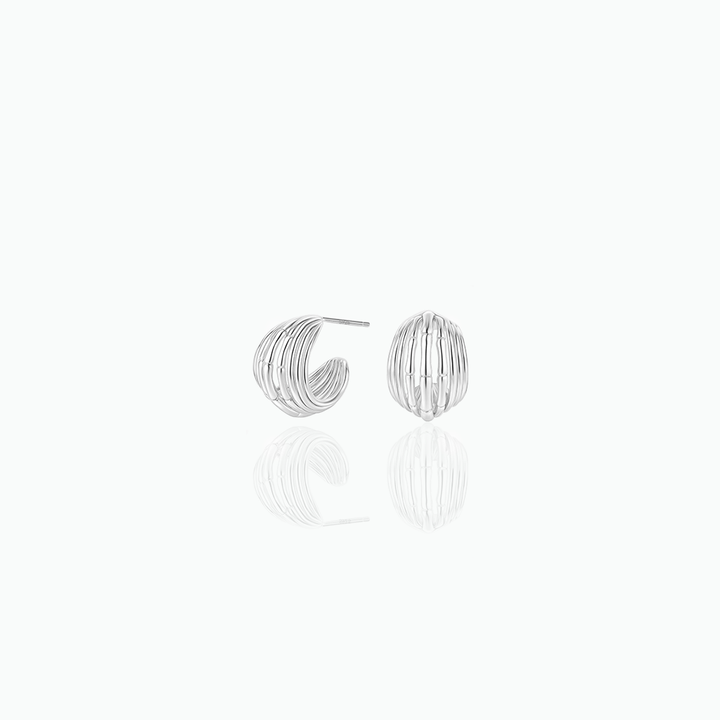 Silver hoop earrings on a white background