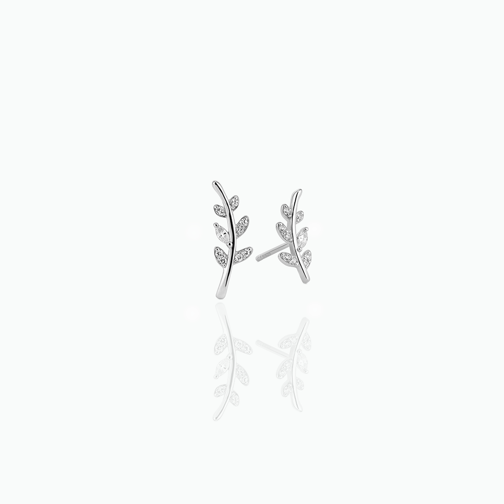 Silver leaf-shaped earrings on a white background