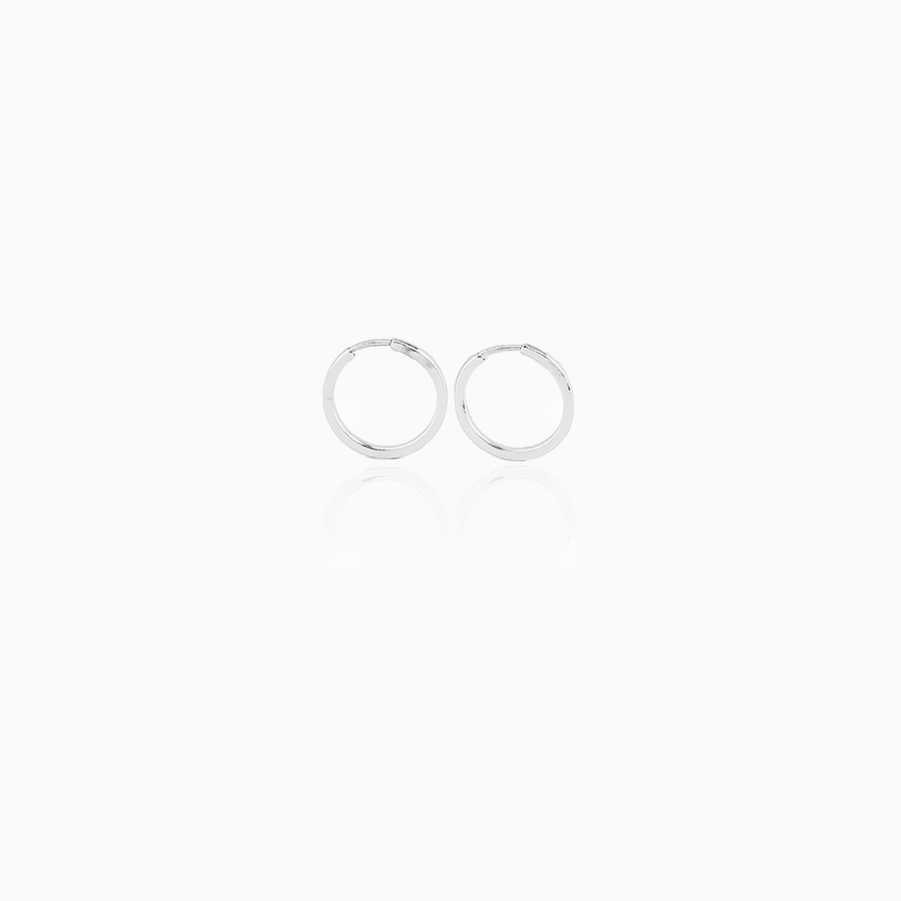 Two silver hoop earrings on a white background
