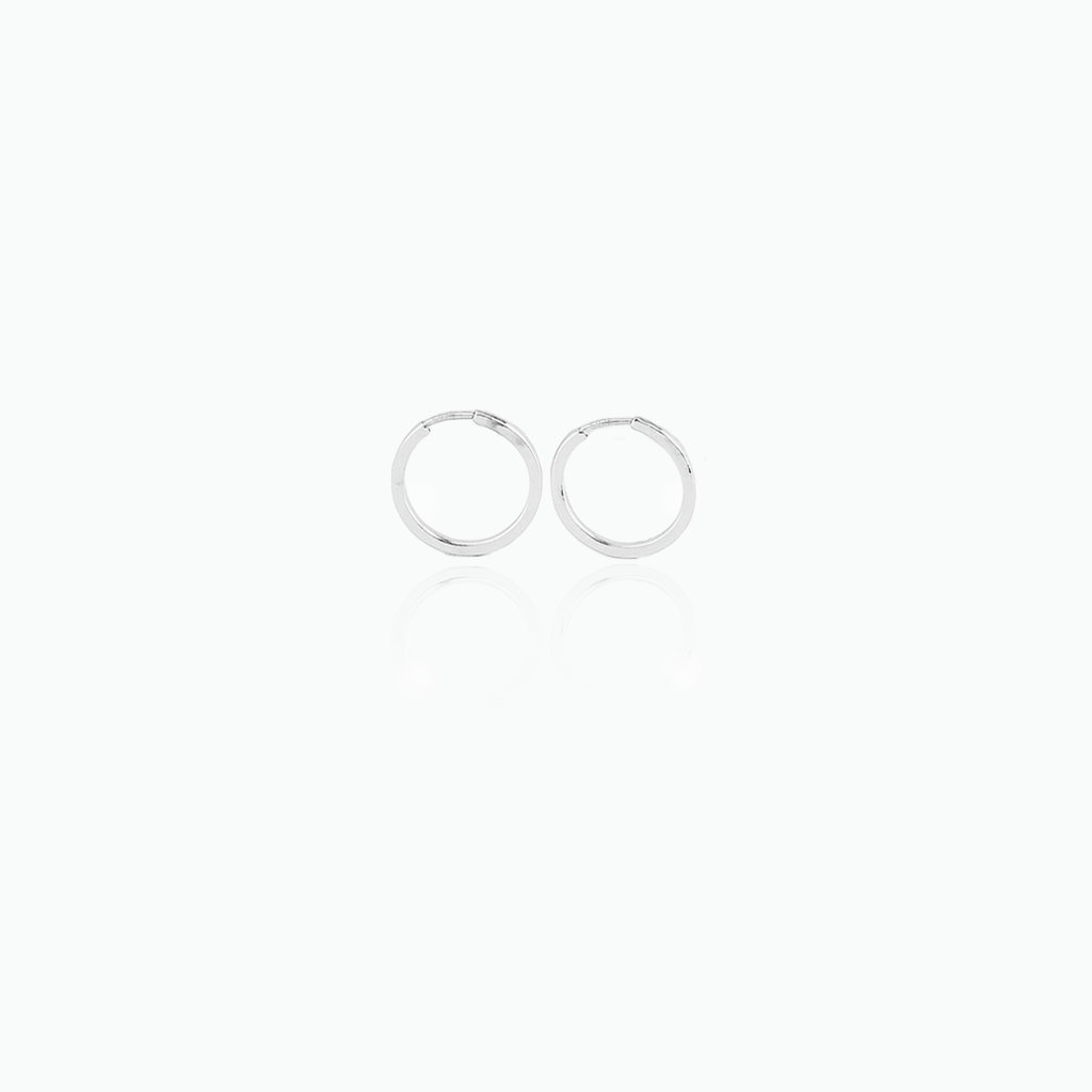Two silver hoop earrings on a white background