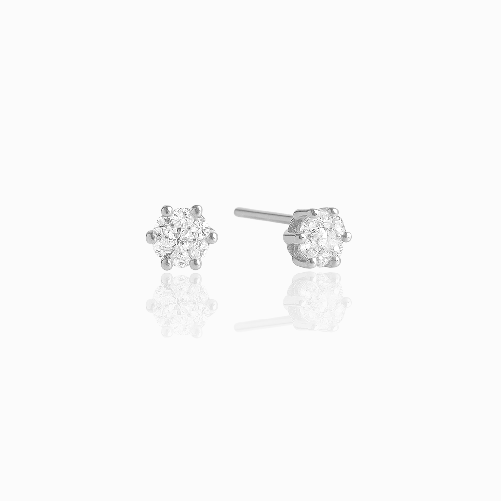 Pair of diamond stud earrings on a white background
