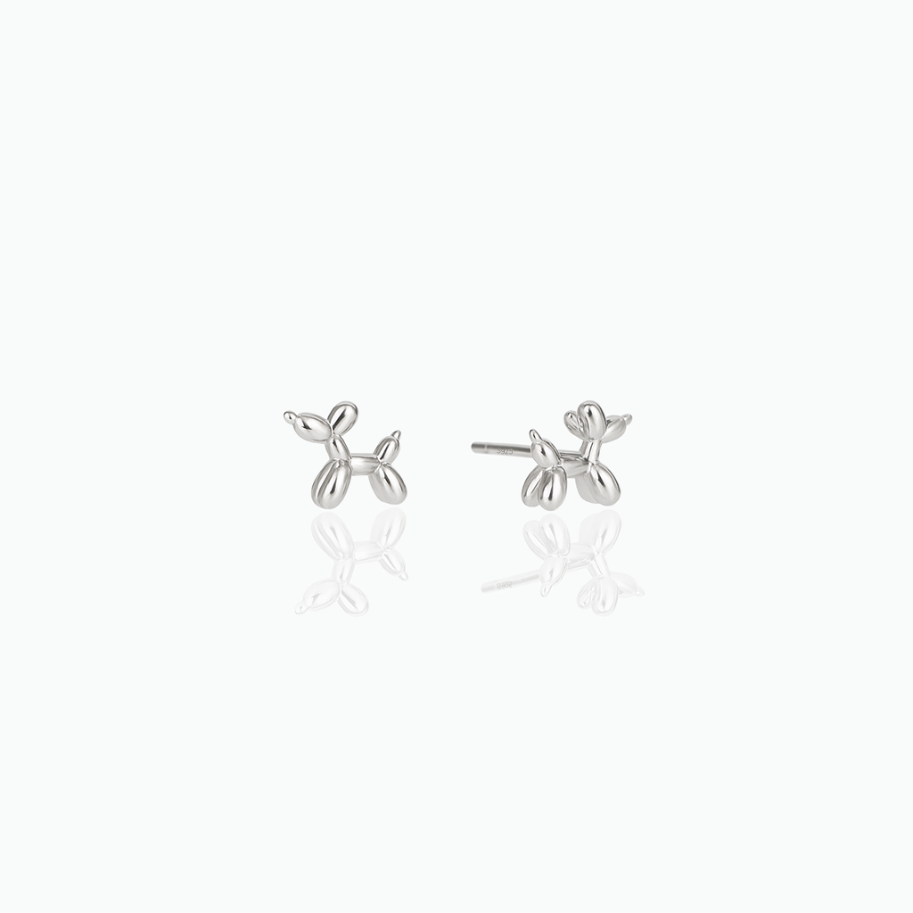 Silver balloon dog-shaped earrings on a white background