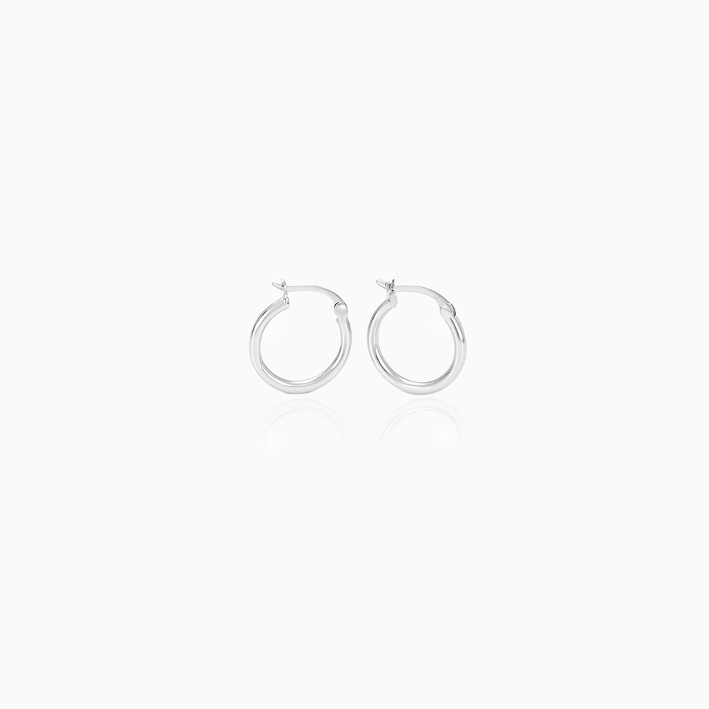 Silver hoop earrings on a white background