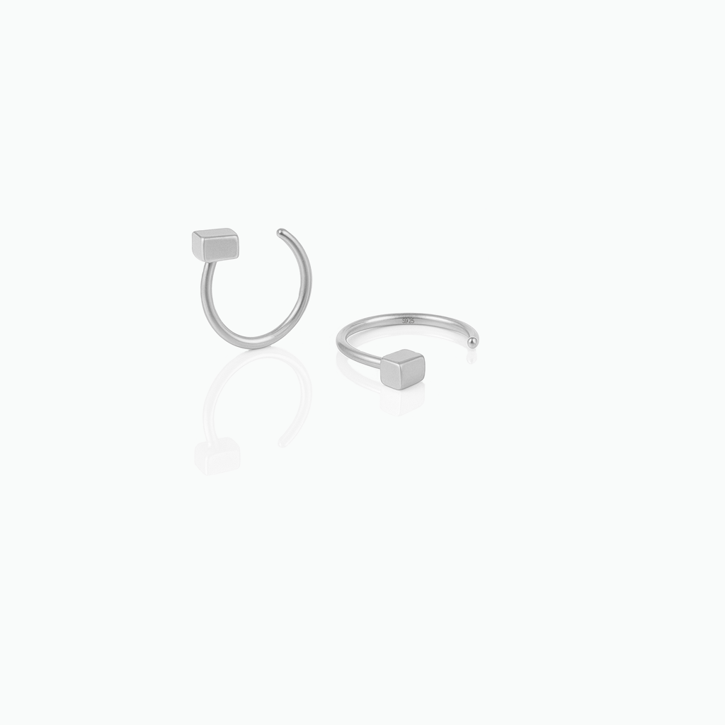 Silver hoop earrings on a white background