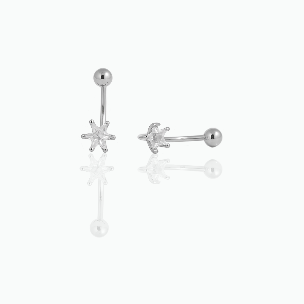 Pair of silver star-shaped earrings on a white background