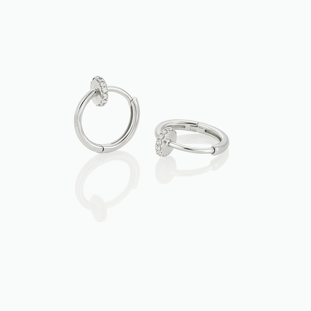 Pair of silver hoop earrings on a white background