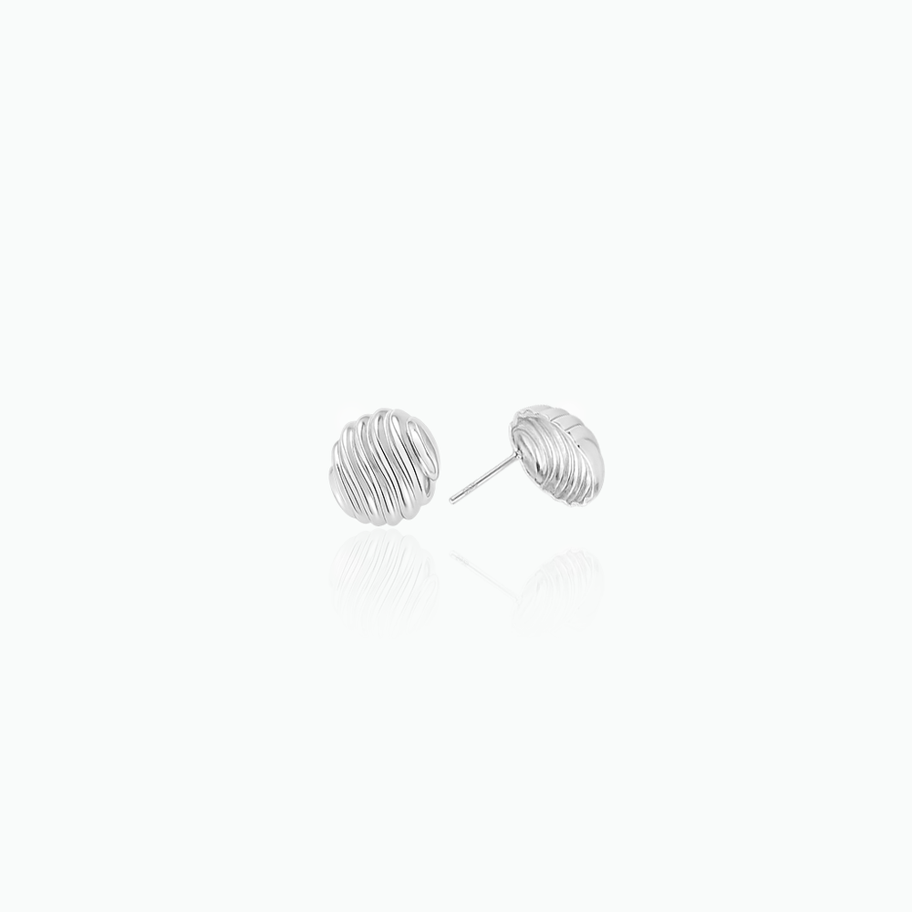 Silver stud earrings on a white background