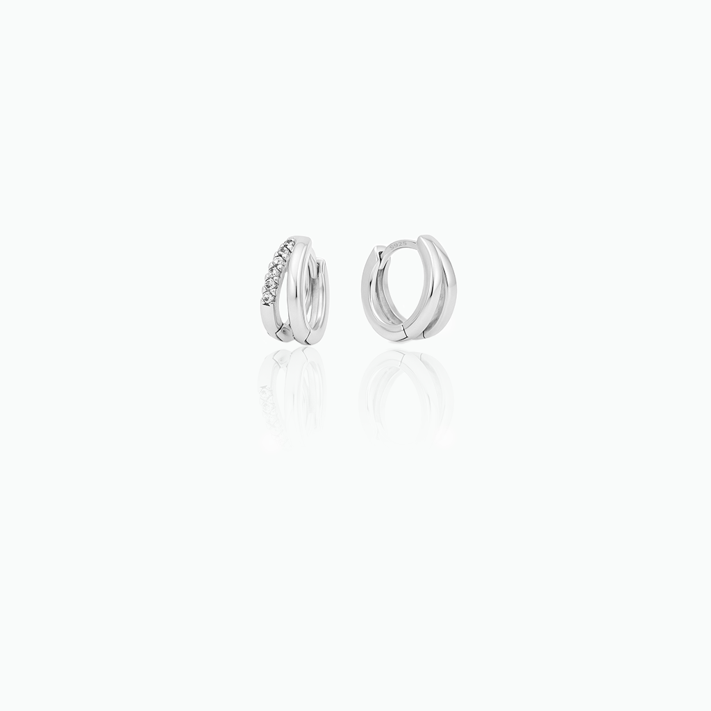 Pair of silver hoop earrings on a white background
