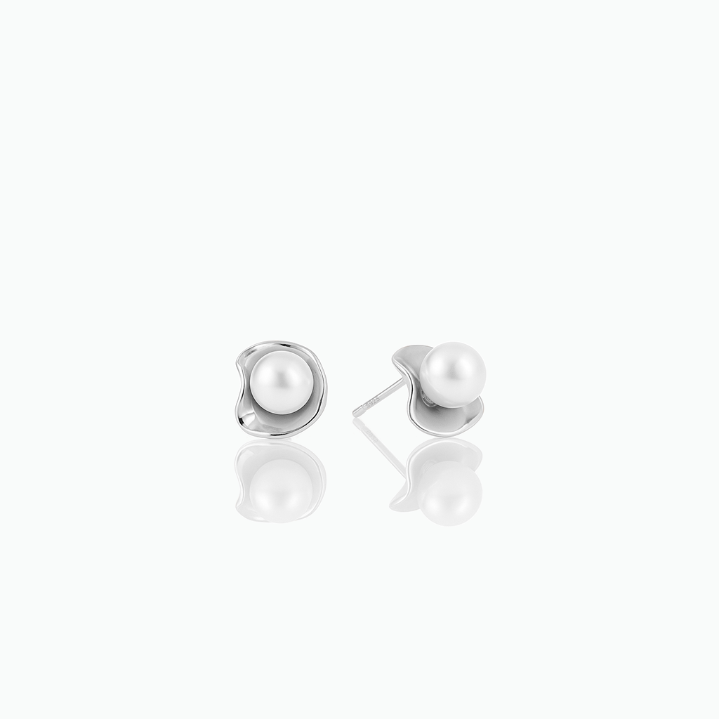Pair of pearl earrings on a white background
