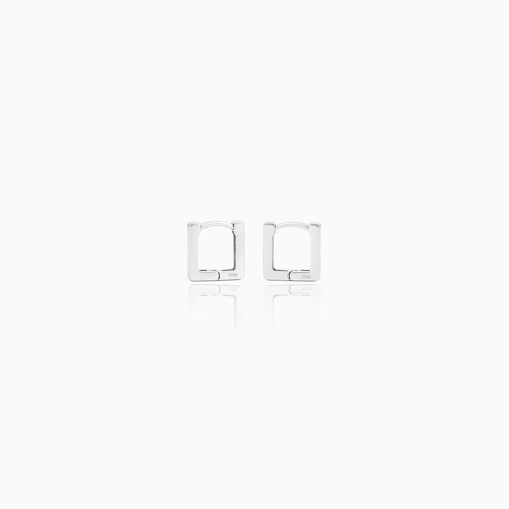 Pair of square-shaped silver earrings on a white background