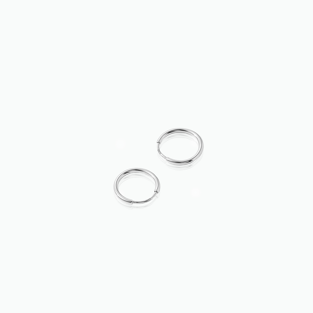 Two silver hoop earrings on a white background