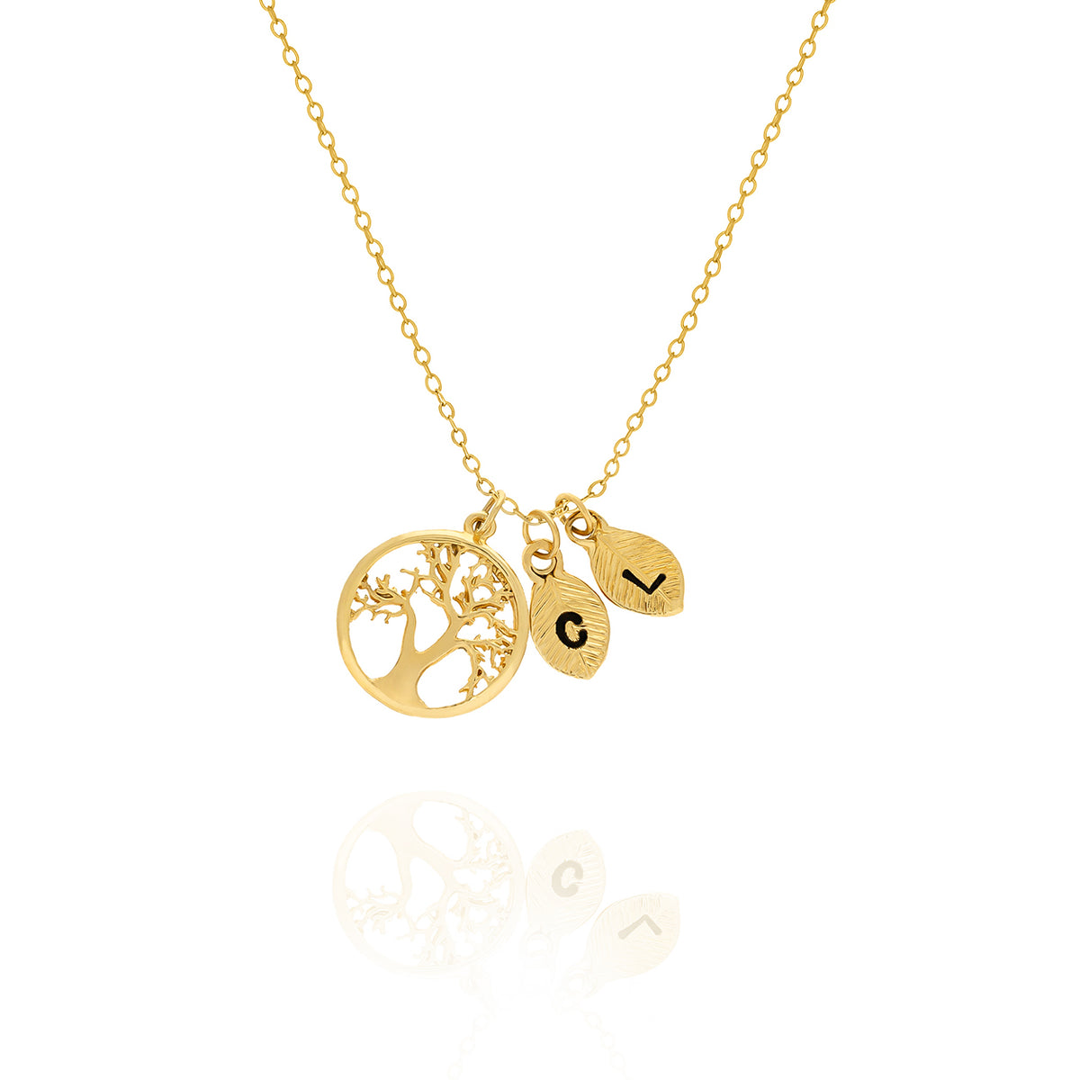 Gold-tone tree of life necklace with two leaf-shaped initial charms engraved C and V on a white background