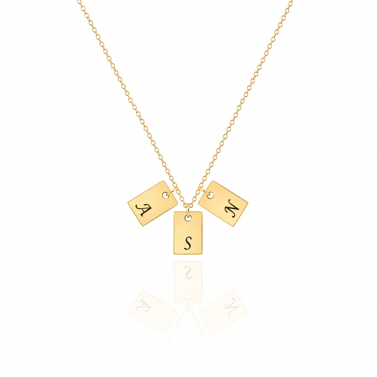 Gold-tone necklace with three rectangular tag pendants engraved A, S, and M on a white background
