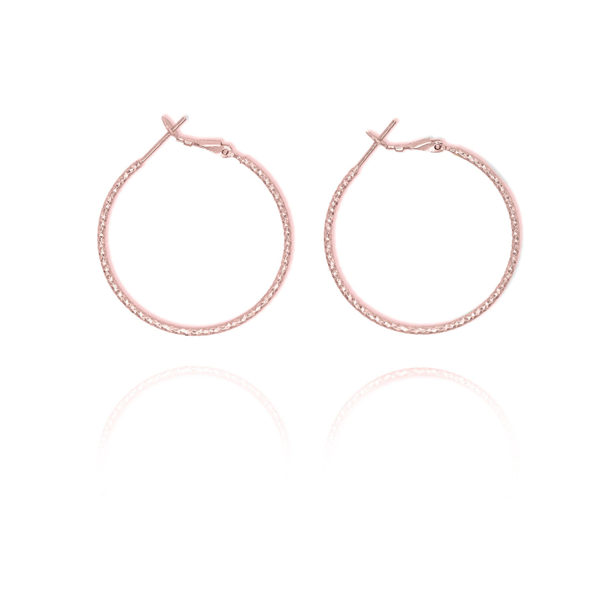 A pair of large thin hoop earrings in gold color.